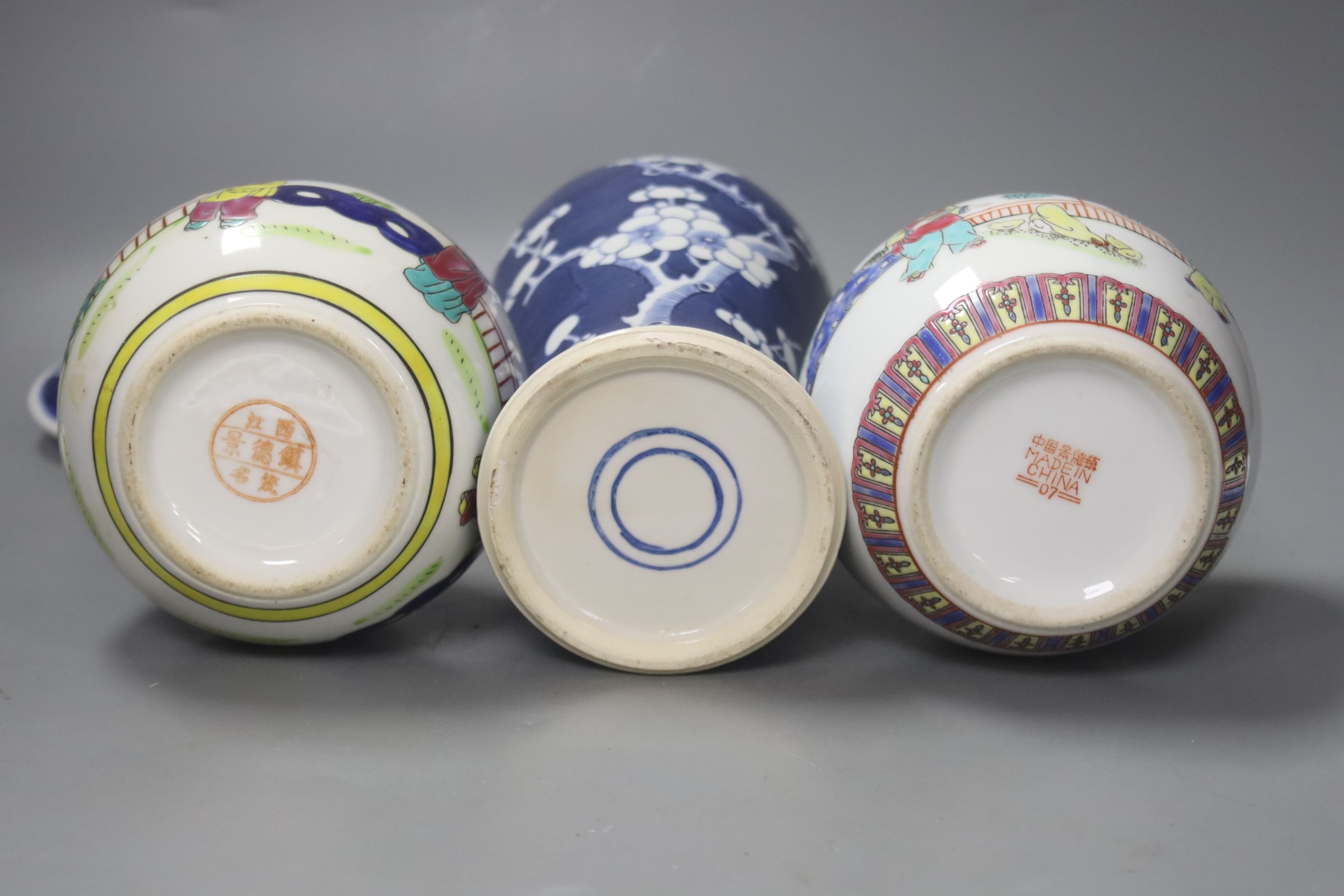 Two pairs of Chinese jars, one pair with covers, two other jars and a blue and white vase and cover, height 26cm